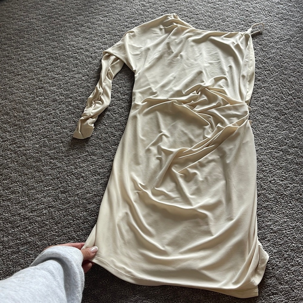 Dress with one long sleeve